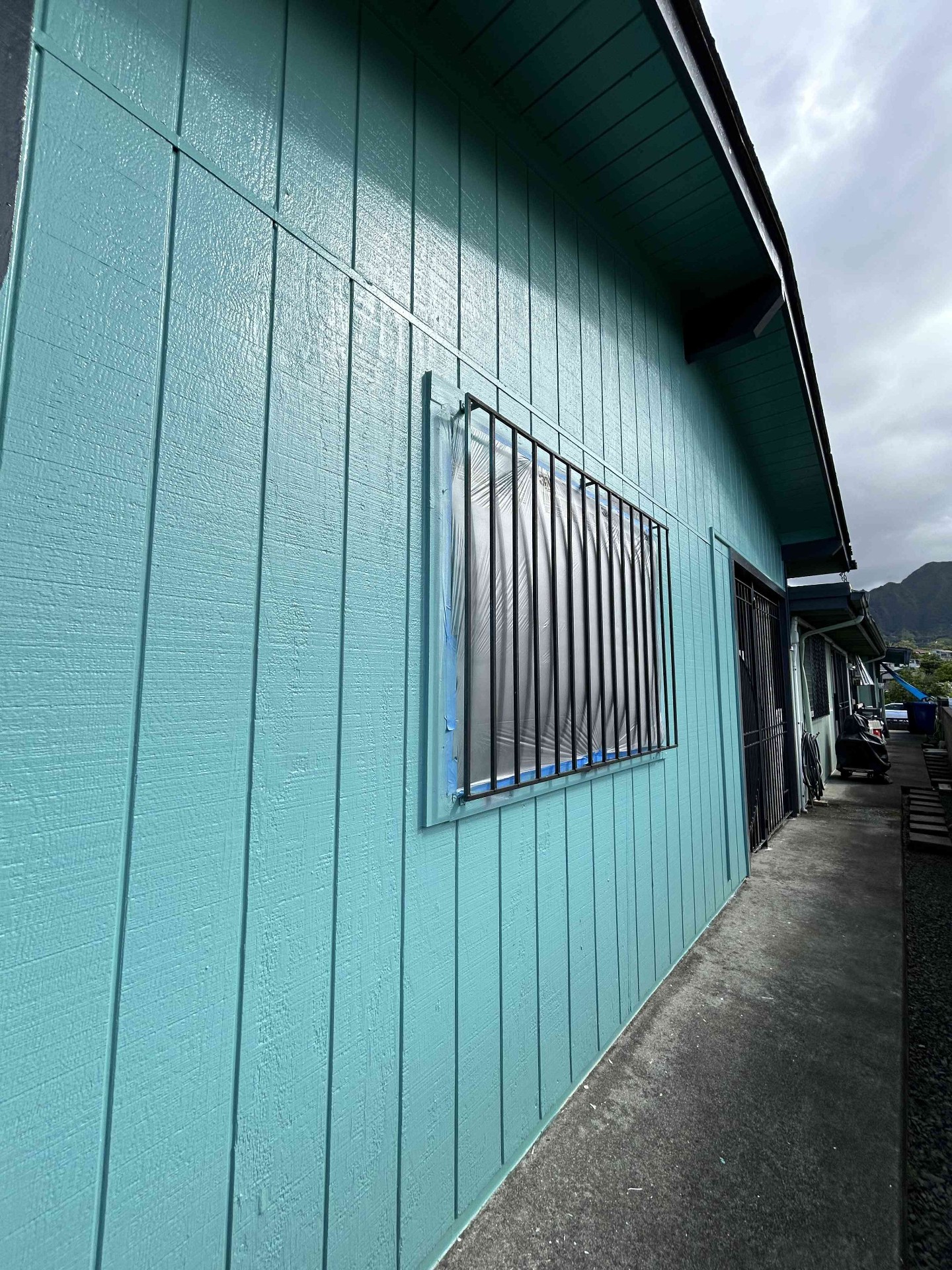 Freshly painted teal exterior with crisp window trim